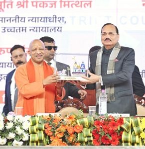 UP Chief Minister Yogi Adityanath present a momento to Chief Justice of India Justice Suryakant at occasion in Chandauli 